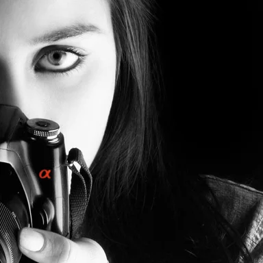 Free Stock Photo: A beautiful girl with a digital camera