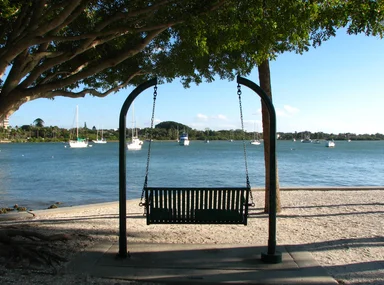 Free Stock Photo: A swinging chair in a park overlooking the ocean
