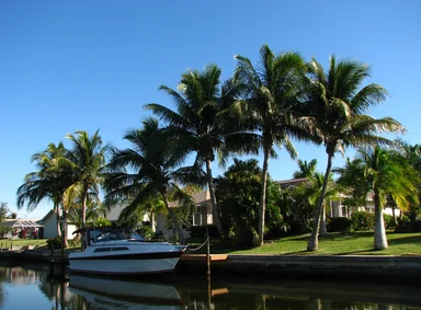 Free Stock Photo: A boat docked by a waterfront house