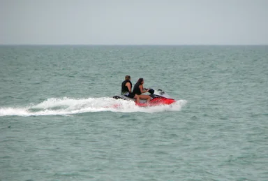 Free Stock Photo: People riding a waverunner on the ocean