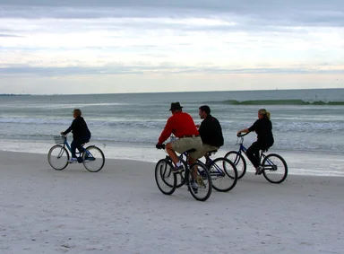 Free Stock Photo: People riding bikes on the beach