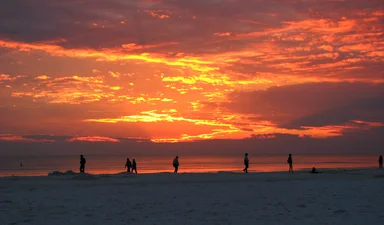 Free Stock Photo: People watching the sunset on the beach