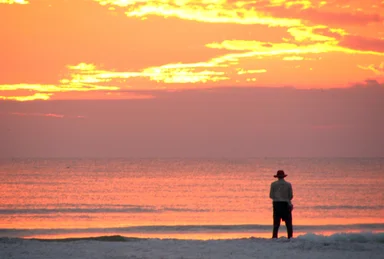 Free Stock Photo: A person watching the sunset on the beach