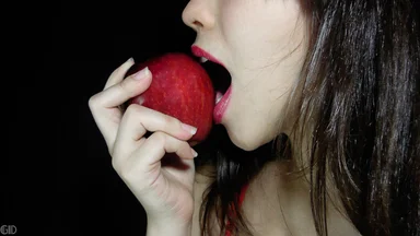 Free Stock Photo: A beautiful woman eating an apple